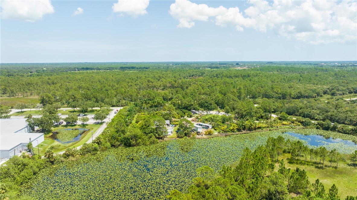 10255 99th Way Sebastian, FL 32958 - Photo 19 of 20 an aerial view of residential houses with outdoor space and trees all around