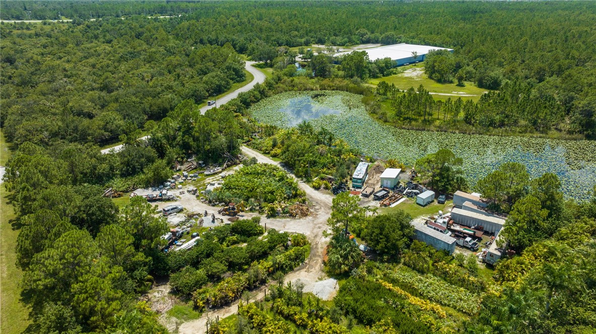 10255 99th Way Sebastian, FL 32958 - Photo 2 of 20 an aerial view of residential house with outdoor space and trees all around