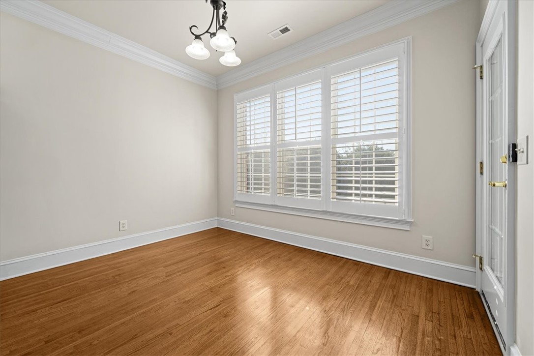 38 Angus Run Seneca, SC 29672 - Photo 13 of 46 This versatile room features warm hardwood flooring, elegant crown molding, and abundant natural light.