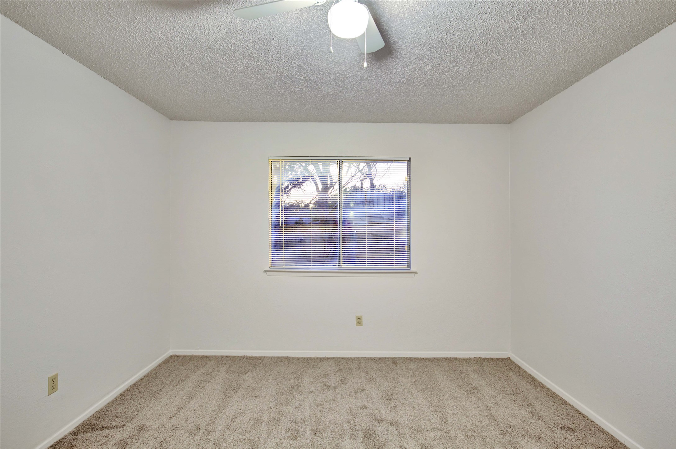 2807 Firecrest Drive Austin, TX 78748 - Photo 14 of 30 Carpeted room featuring a single window with blinds and a ceiling fan with integrated lighting