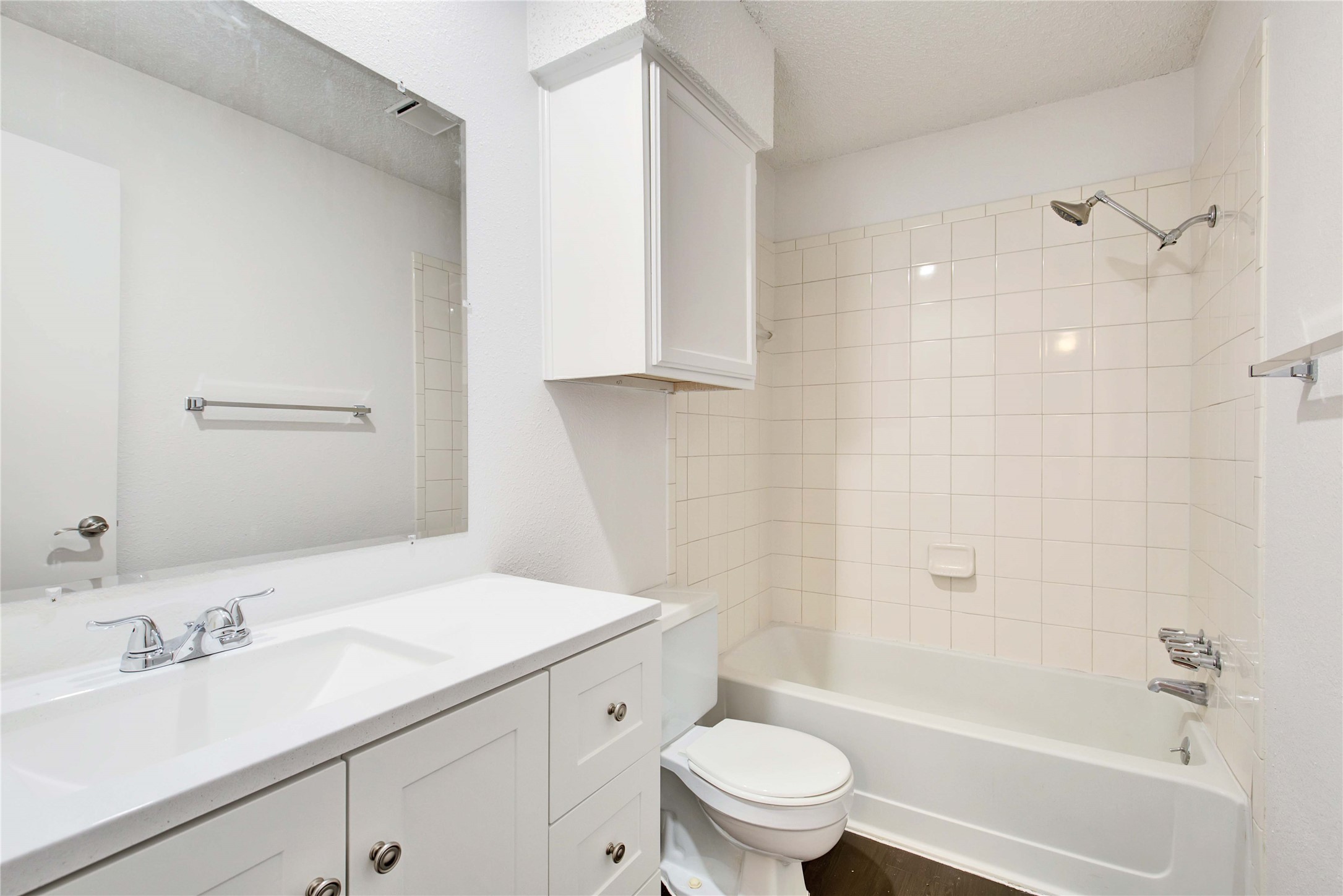 2807 Firecrest Drive Austin, TX 78748 - Photo 19 of 30 Bathroom featuring a white vanity with integrated sink, chrome faucet, and a large wall-mounted mirror