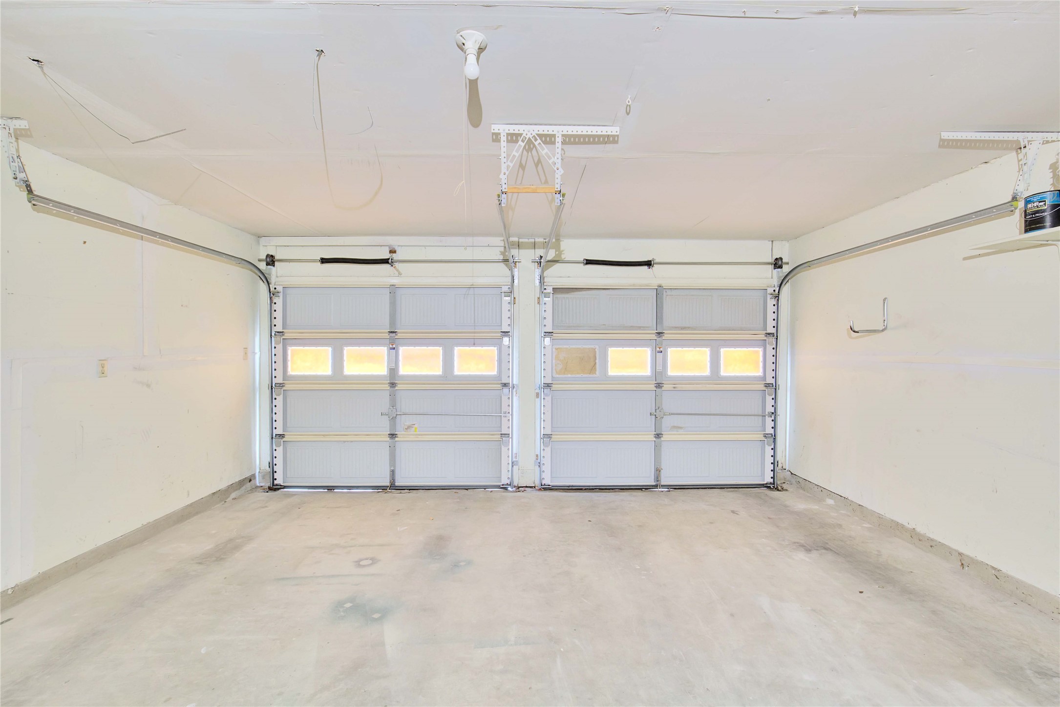 2807 Firecrest Drive Austin, TX 78748 - Photo 4 of 30 Two-car garage featuring segmented overhead doors with clear panel inserts