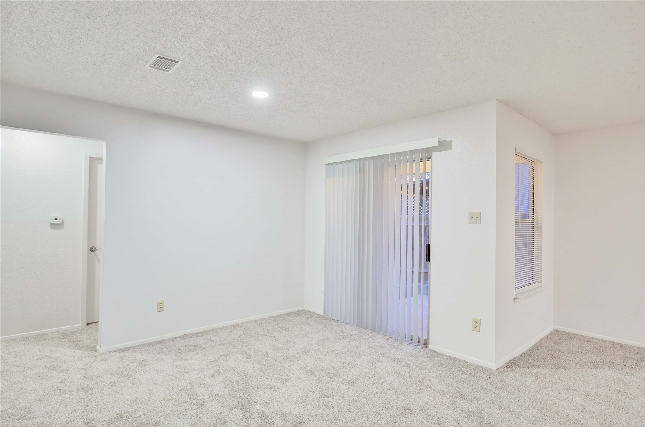 2807 Firecrest Drive Austin, TX 78748 - Photo 8 of 30 Interior space featuring light gray carpet flooring and white painted walls