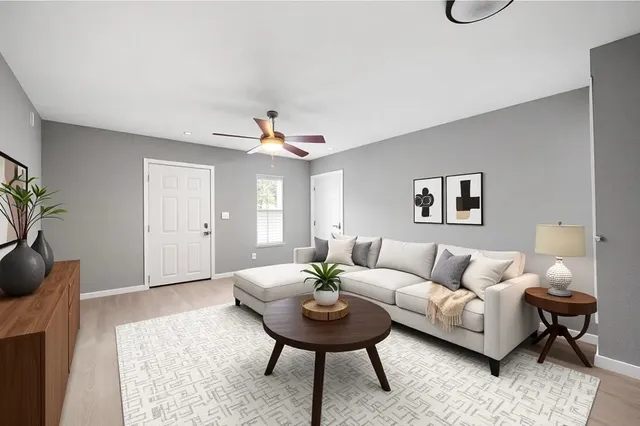 a view of a yard in front of a house with large tree