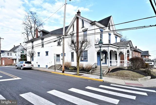 a view of a street with cars