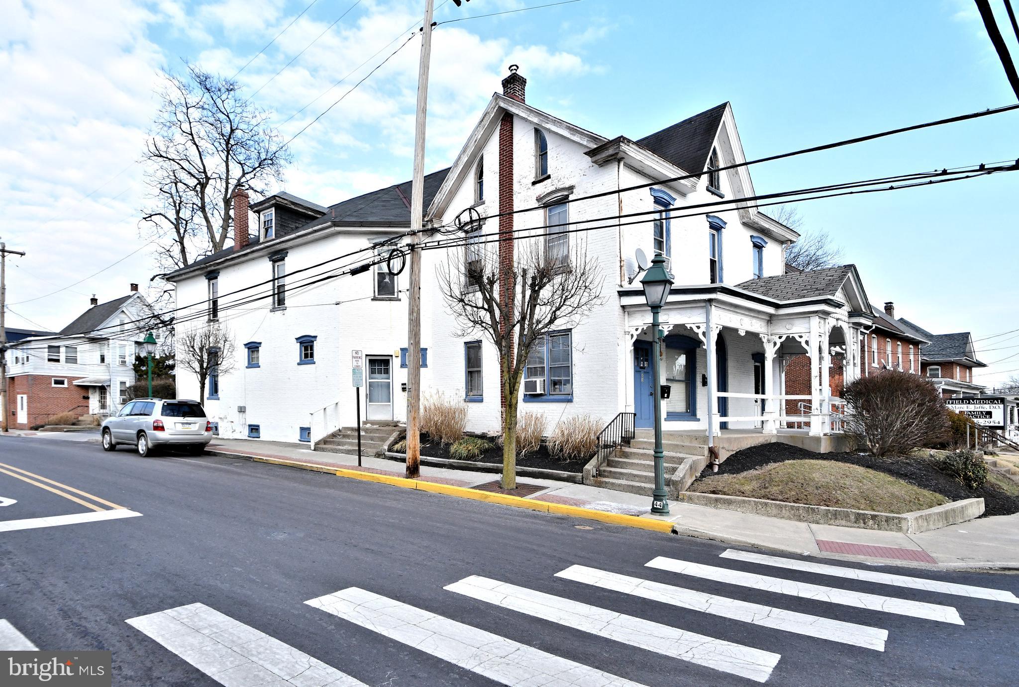 a view of a street with cars
