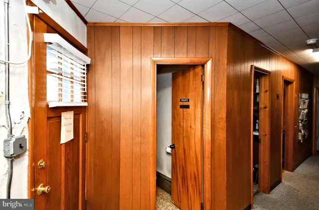 a bathroom with a sink mirror and toilet