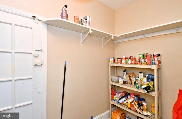 a room with gym equipment and a flat screen tv