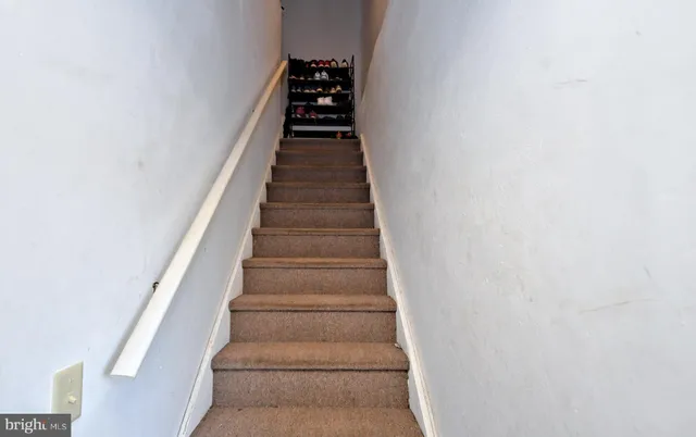 a room with gym equipment and a flat screen tv