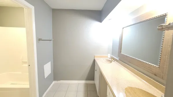 a bathroom with a tub and sink