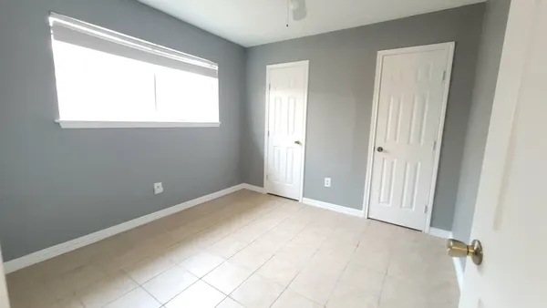 an empty room with windows