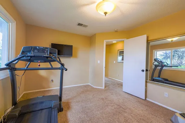 a bedroom with furniture and windows