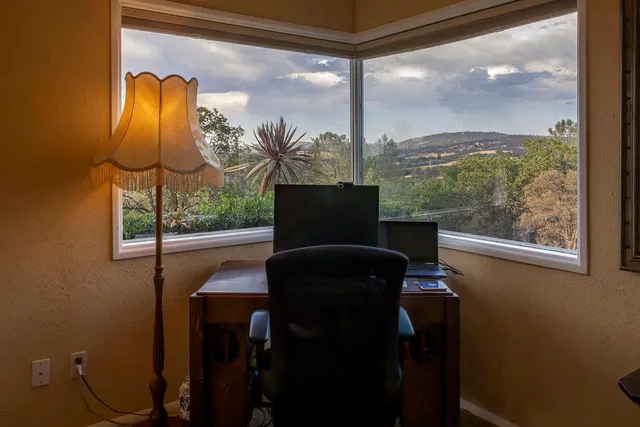 a bedroom with bed and window