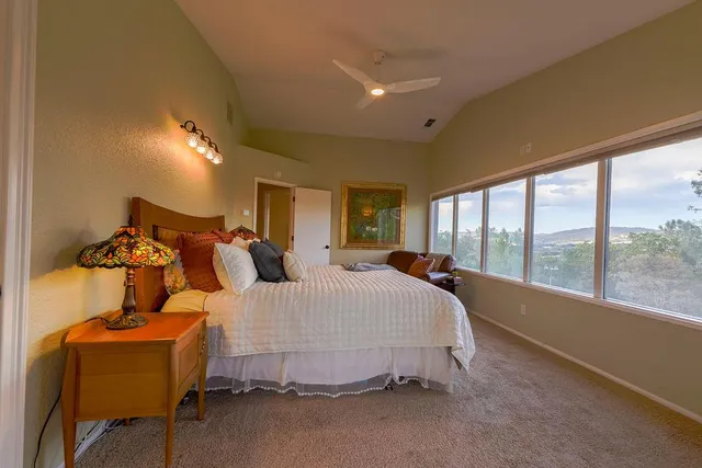 a bed room with a bed and a window