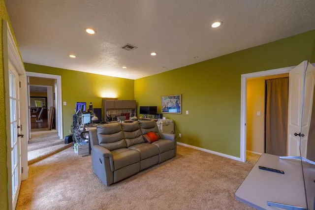 a bathroom with a toilet a sink and shower