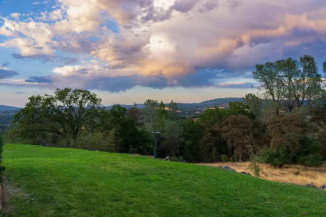 a backyard of a house with outdoor seating