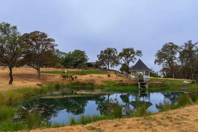 an aerial view of a house with outdoor space