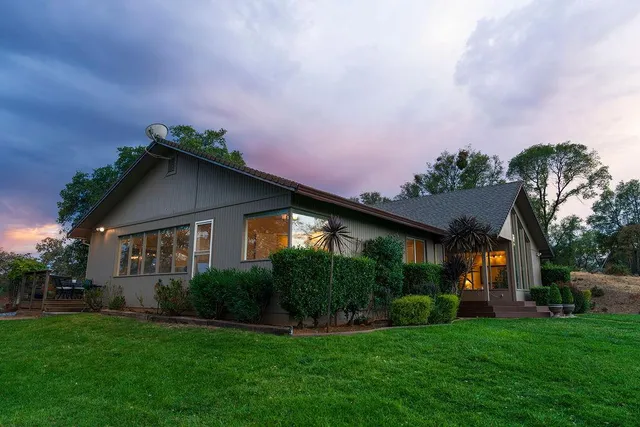 a house with garden in front of it