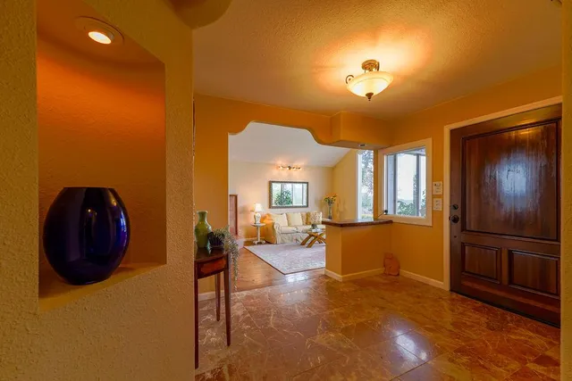 a view of a livingroom with furniture cabinets and wooden floor