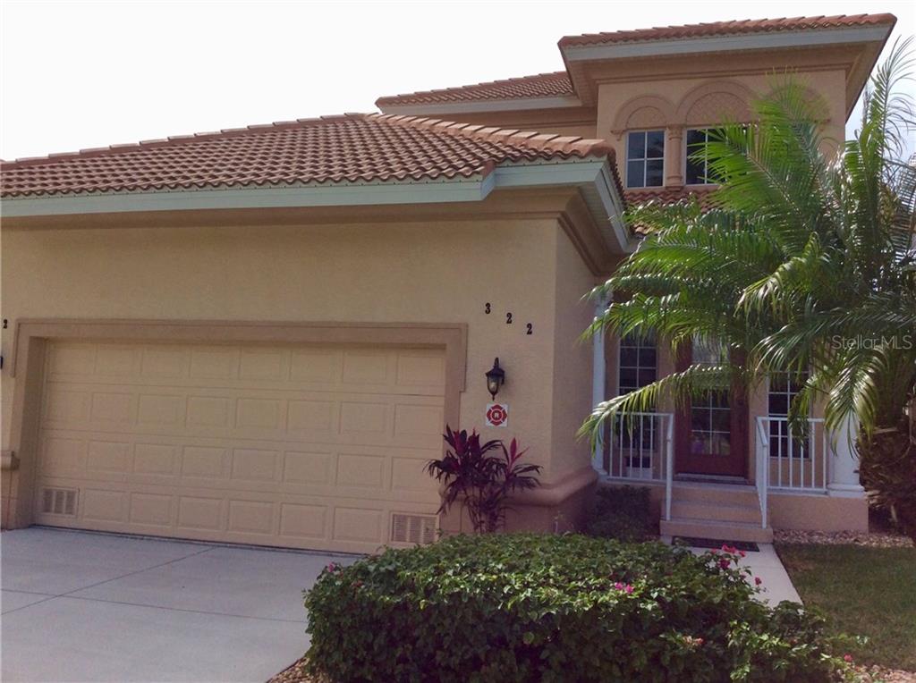 3959 San Rocco Drive, Unit 322 Punta Gorda, FL 33950 - Photo 1 of 1 a view of a house with a yard