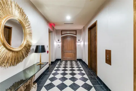 a spacious bathroom with a sink and a mirror