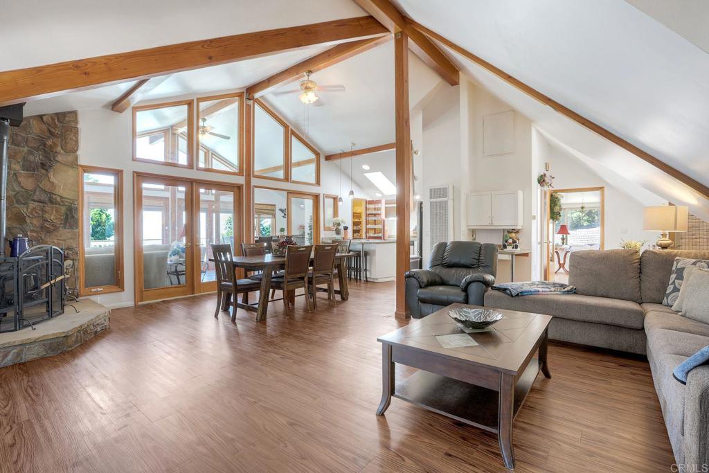 22223 Crestline Road Palomar Mountain, CA 92060 - Photo 59 of 90 a living room with furniture a wooden floor and a large window