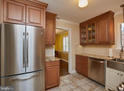 4624 19th Road North Arlington, VA 22207 - Photo 8 of 22 a kitchen with stainless steel appliances granite countertop a refrigerator and a sink