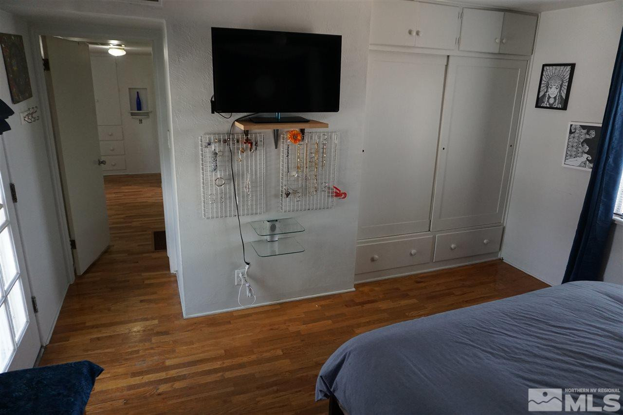 845 Bates Avenue Reno, NV 89502 - Photo 15 of 18 a bedroom with a bed and a flat screen tv