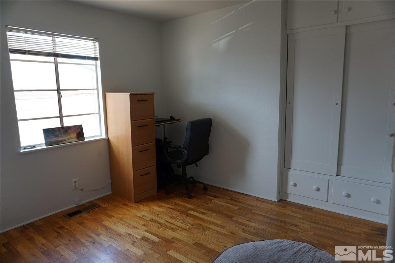 845 Bates Avenue Reno, NV 89502 - Photo 16 of 18 a view of workspace with wooden floor and cabinet