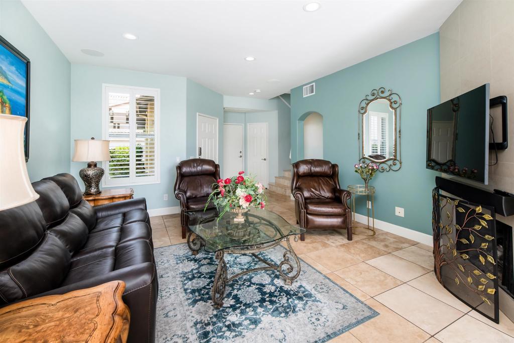 6817 Adolphia Drive Carlsbad, CA 92011 - Photo 6 of 34 a living room with furniture and a flat screen tv