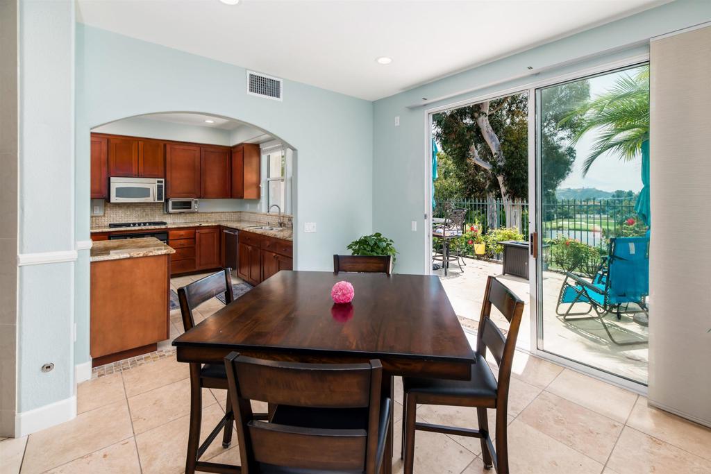 6817 Adolphia Drive Carlsbad, CA 92011 - Photo 8 of 34 a view of a dining room with a table and chairs