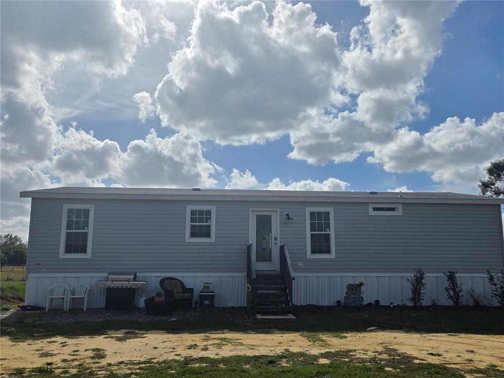 a view of a house with a swimming pool