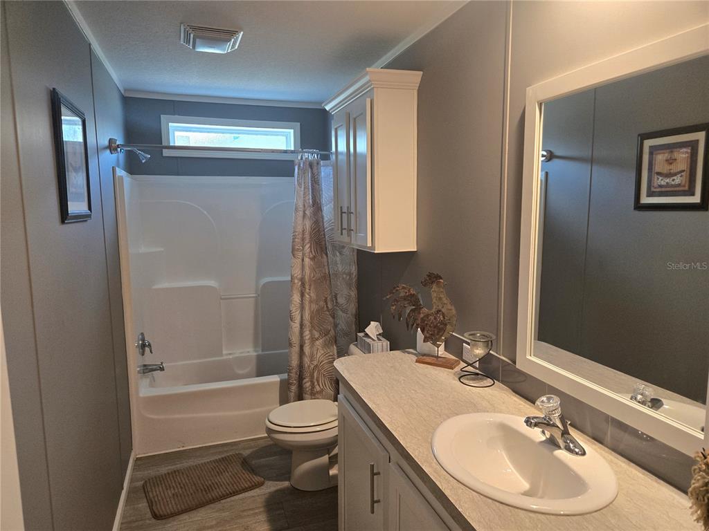 1981 Southeast Piggy Back Road Arcadia, FL 34266 - Photo 14 of 19 a bathroom with a granite countertop sink toilet and shower