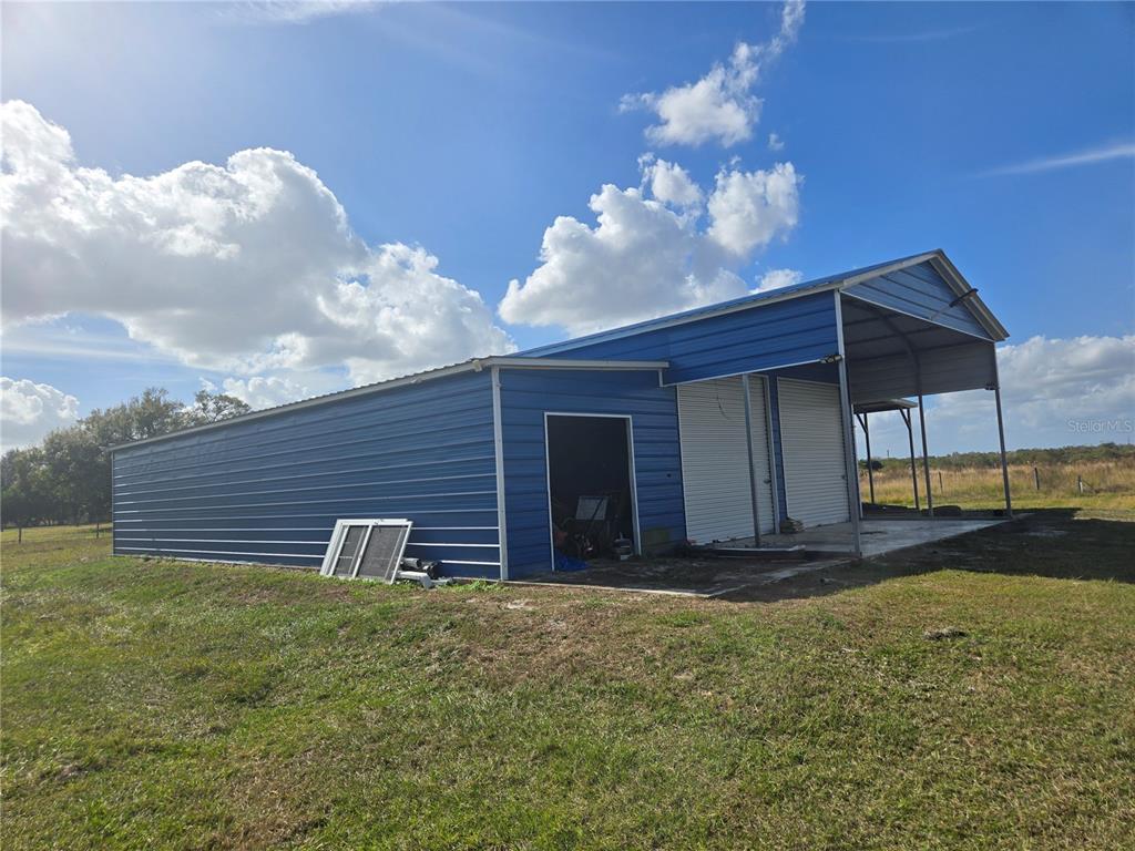 1981 Southeast Piggy Back Road Arcadia, FL 34266 - Photo 15 of 19 a view of a house with a yard