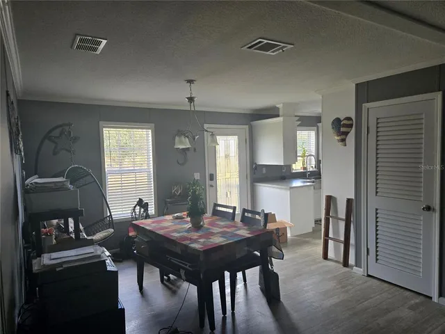 a view of a dining room with furniture