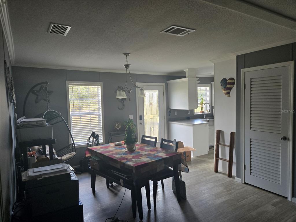 1981 Southeast Piggy Back Road Arcadia, FL 34266 - Photo 3 of 19 a view of a dining room with furniture