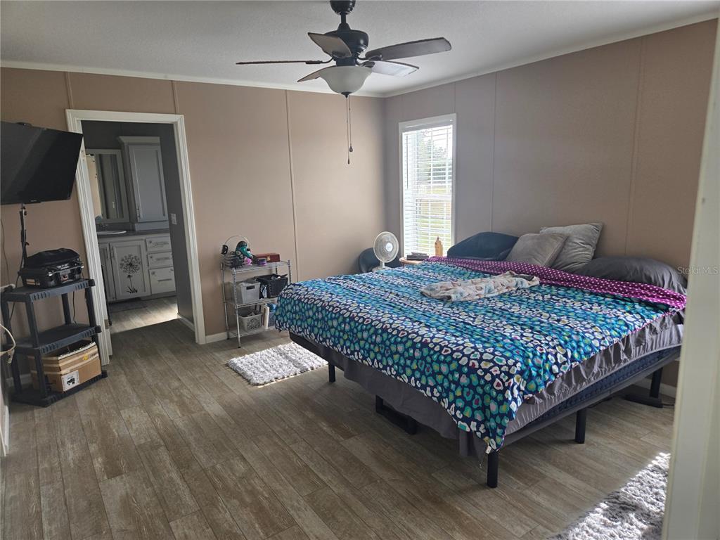 1981 Southeast Piggy Back Road Arcadia, FL 34266 - Photo 10 of 19 a bed sitting in a spacious bedroom next to a window