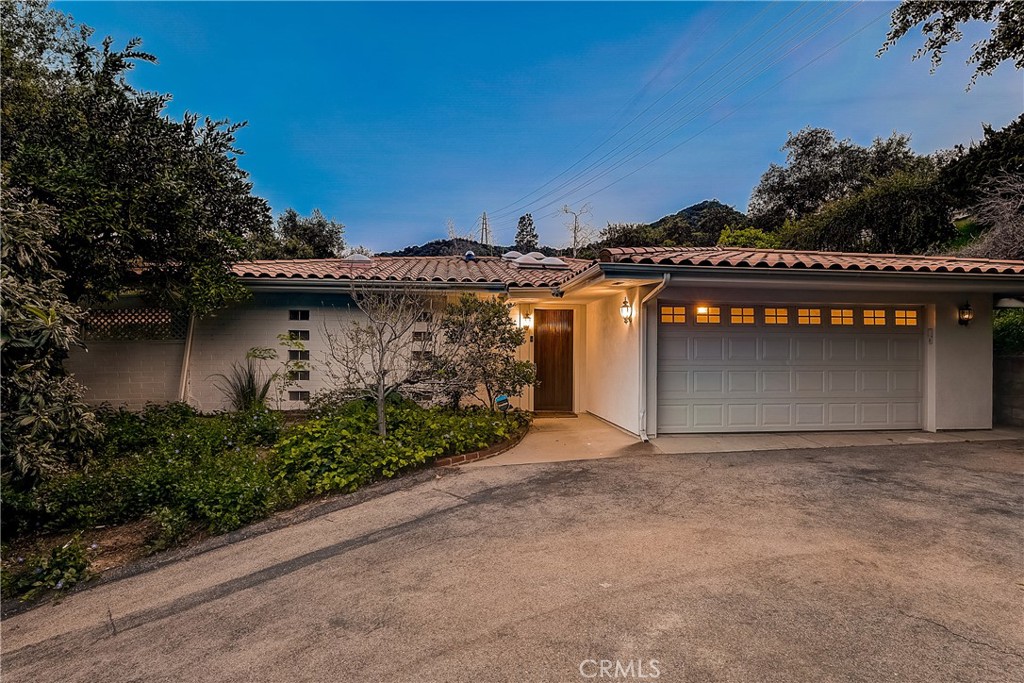 321 Whiting Woods Road Glendale, CA 91208 - Photo 1 of 1 a front view of a house with a garage