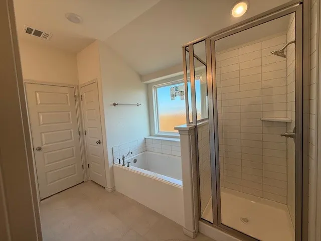 a white toilet sitting next to a shower