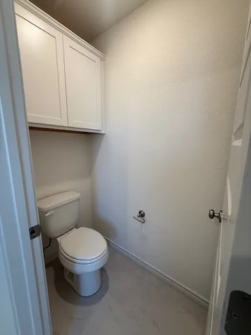 a bathroom with a sink double vanity granite tub shower and a mirror