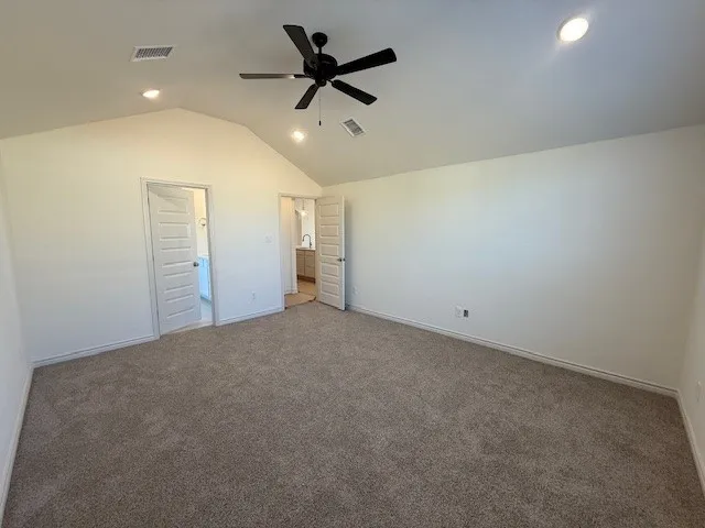 a kitchen with a sink a microwave and cabinets