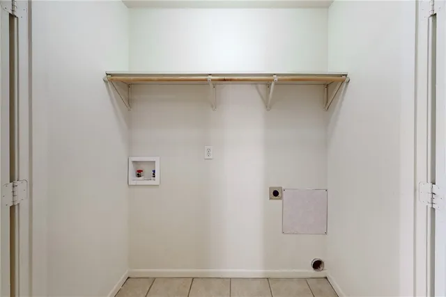 a kitchen with granite countertop a sink stove and cabinets