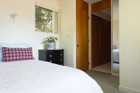 a bedroom with a bed and a cabinets