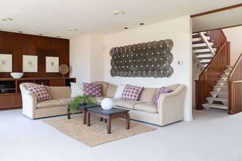 a living room with furniture and a couch