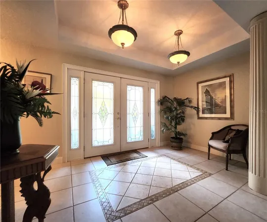 a bedroom with a bed couch and window