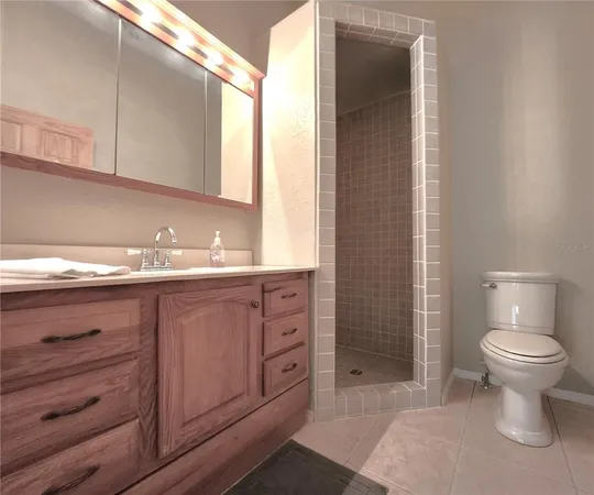 a en suite bathroom with a sink and a mirror