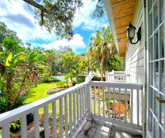 a large kitchen with kitchen island granite countertop wooden cabinets a sink and a stainless steel appliances