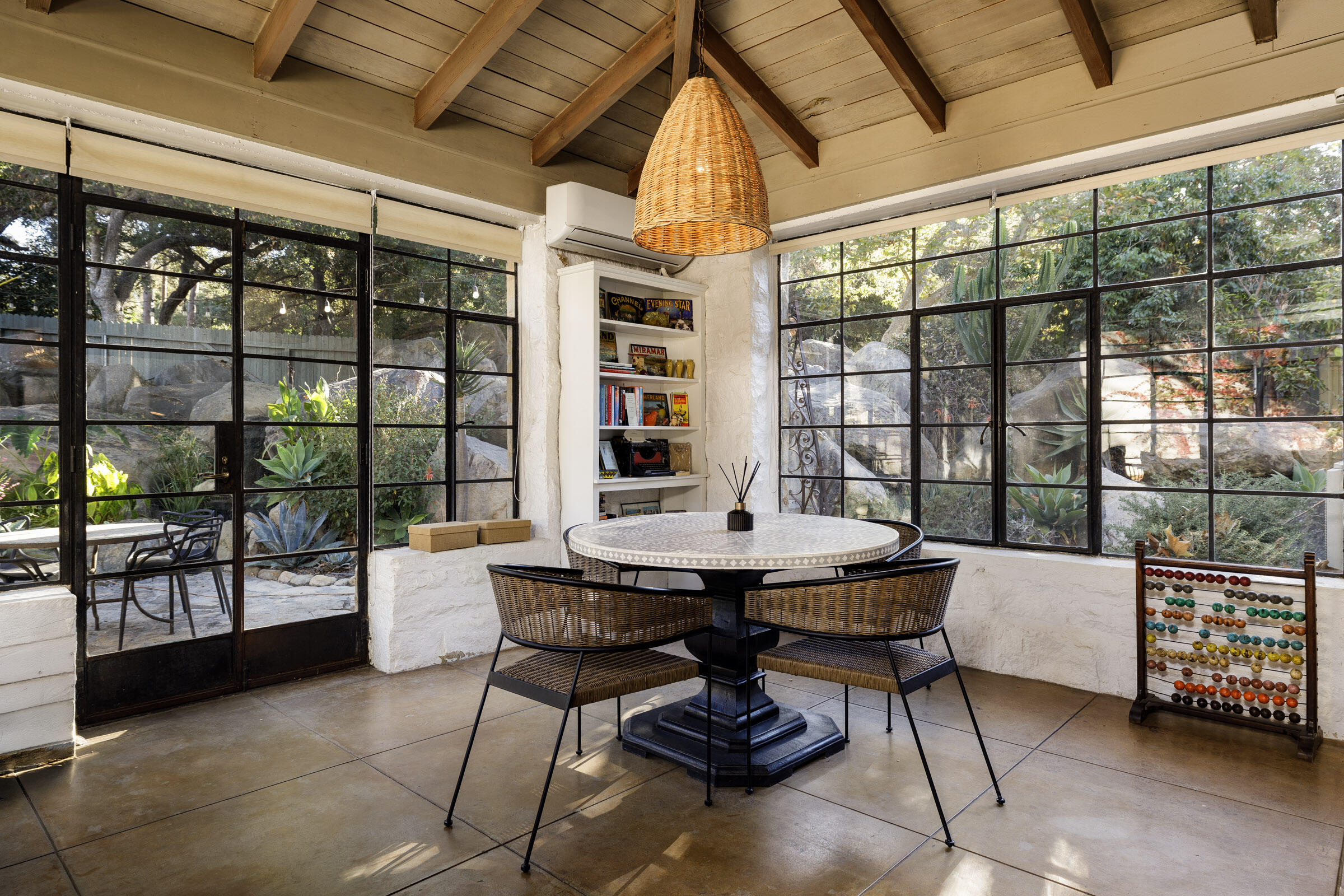 700 Mission Canyon Road Santa Barbara, CA 93105 - Photo 25 of 44 a dining room with furniture and a floor to ceiling window