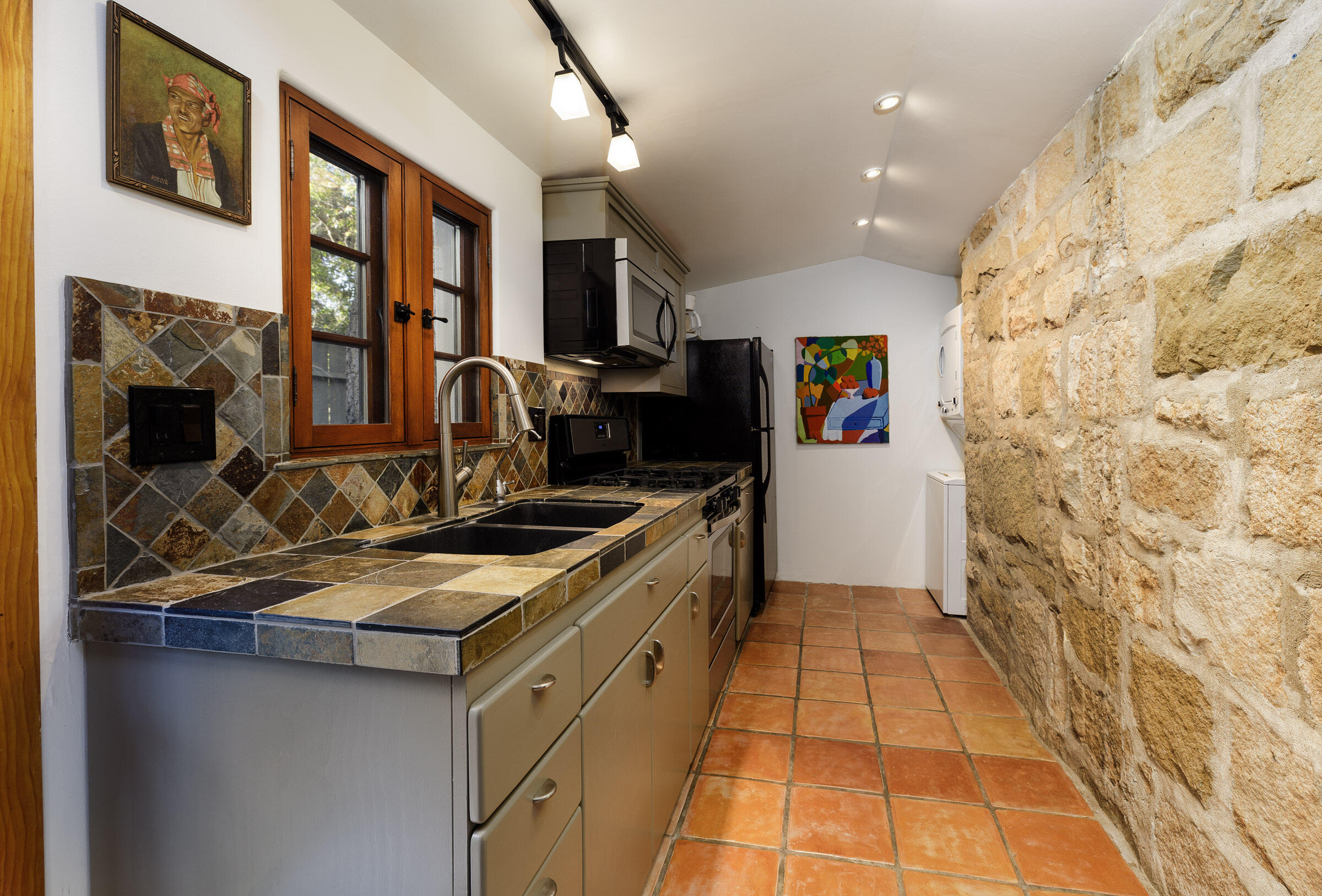 700 Mission Canyon Road Santa Barbara, CA 93105 - Photo 26 of 44 a kitchen with stainless steel appliances granite countertop a stove and a sink
