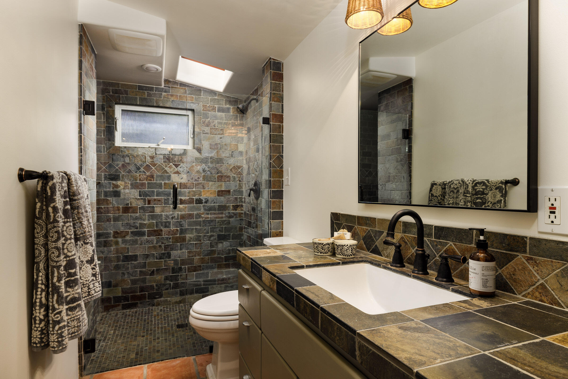 700 Mission Canyon Road Santa Barbara, CA 93105 - Photo 28 of 44 a bathroom with a granite countertop sink toilet and shower